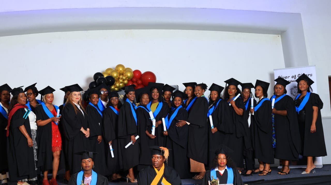 GE College graduates celebrating together at their graduation ceremony